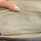 Chloe label on interior suede zipper pocket with light pink staining and wear on the suede.