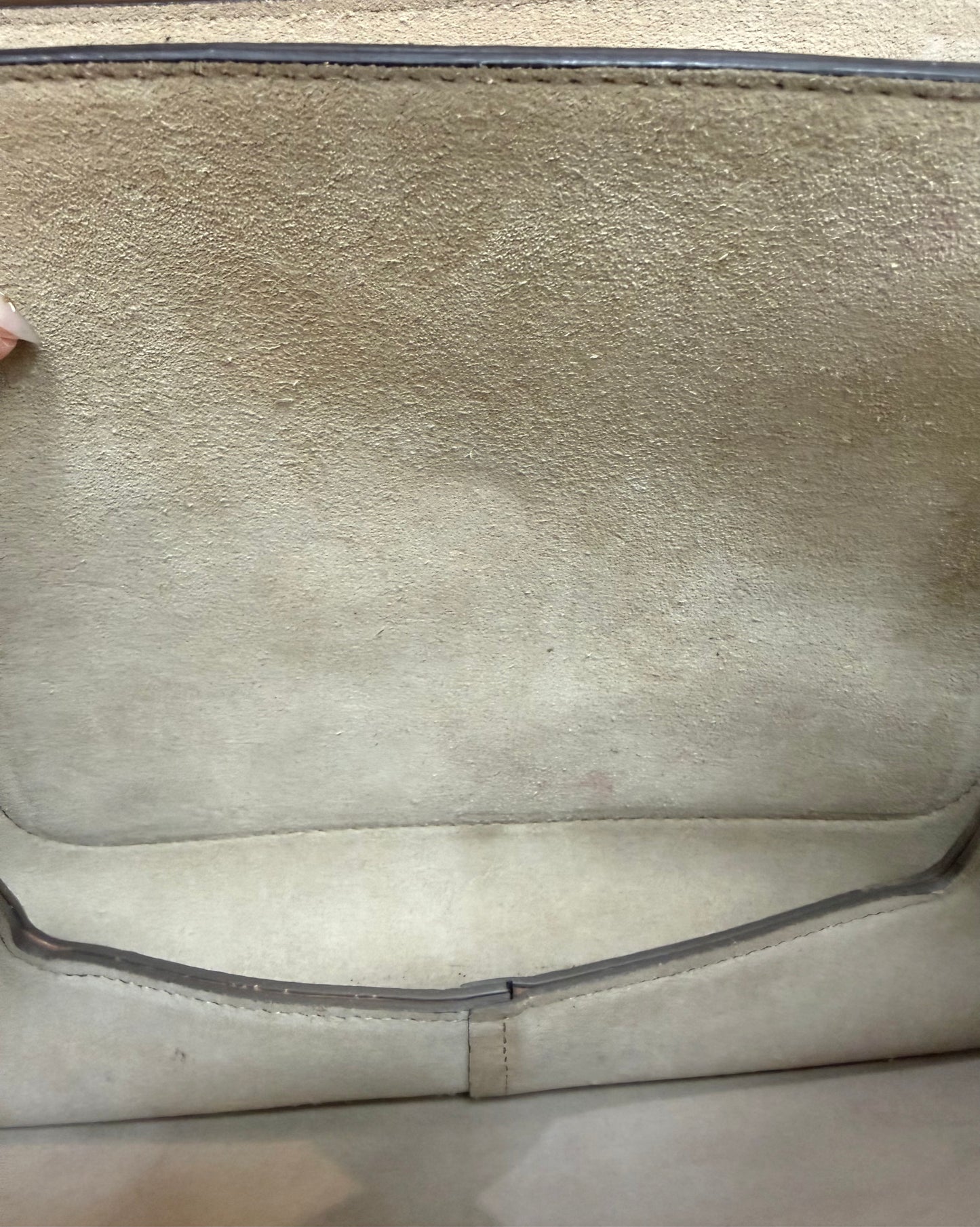 Discoloration, minor staining, and wear on suede interior