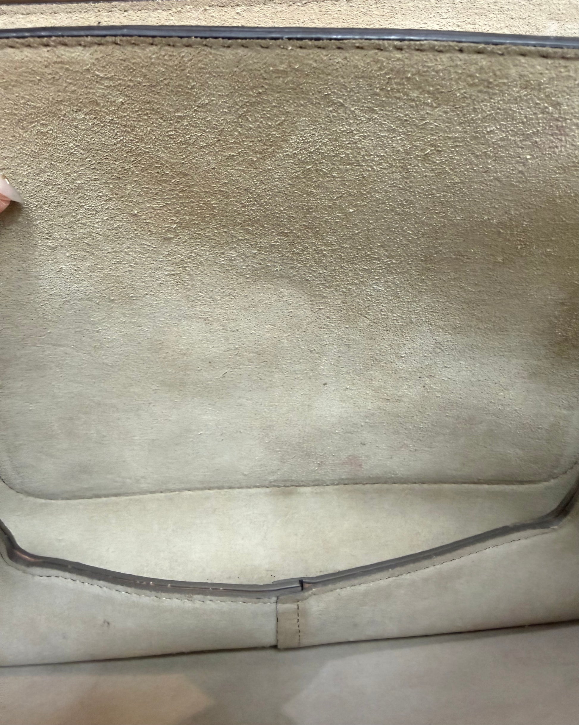 Discoloration, minor staining, and wear on suede interior