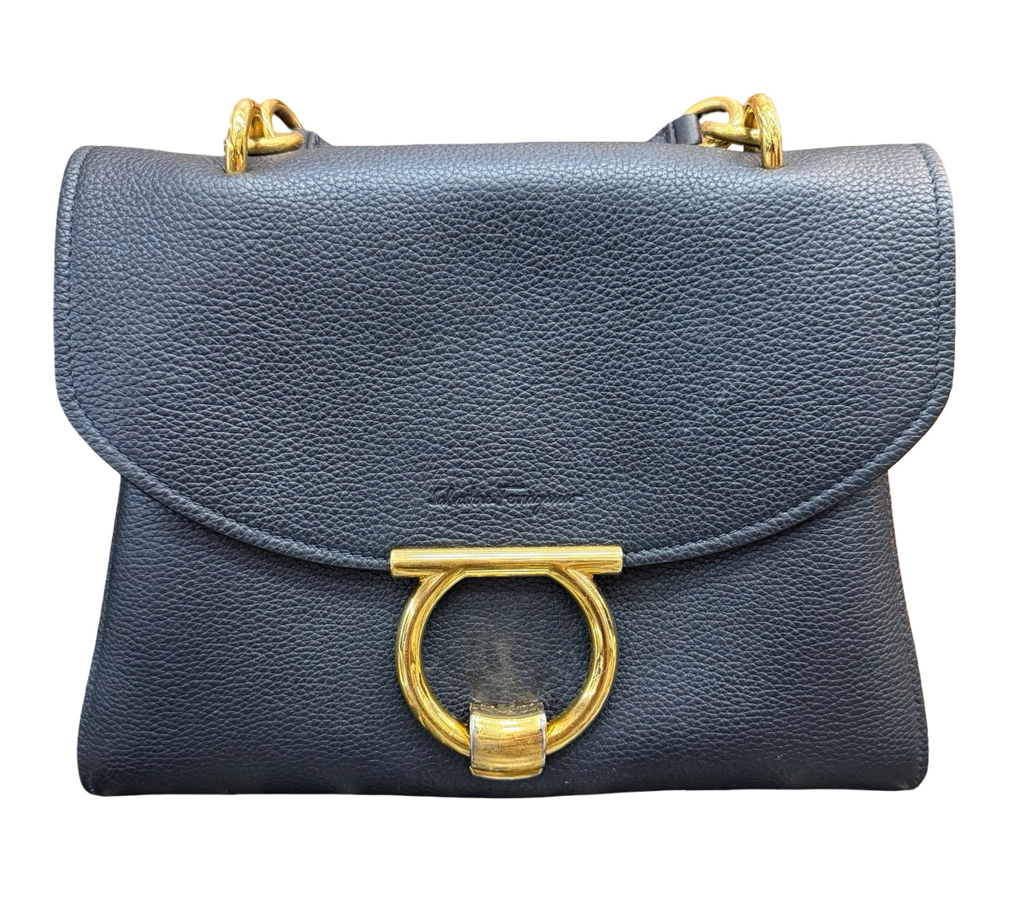 A black pebbled leather shoulder bag with a large gold-tone ring clasp and gold-tone chain strap hardware, shown against a plain white background.