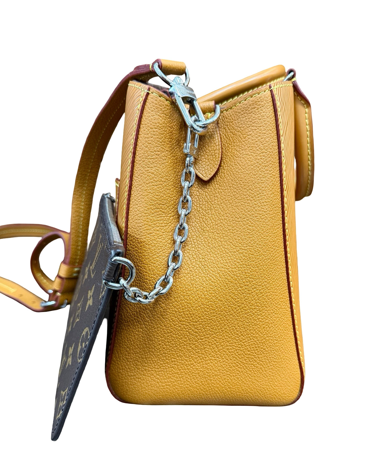 A brown epi leather handbag shown from the side, featuring a silver chain detail and a dark brown monogram pouch attached, set against a plain white background.
