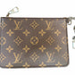 A Louis Vuitton monogram small pouch in brown coated canvas with silver hardware, featuring a silver-tone chain link and clasp on the right side.