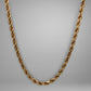 Gold chain on a gray background