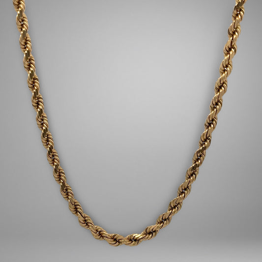 Gold chain on a gray background