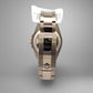 Silver watch with a reflective surface on a gray background. Scratches on band