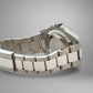 Silver watch with a metal bracelet on a gray background