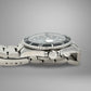 Silver watch with a black dial on a gray background