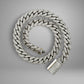 Silver chain necklace with a clasp on a gray background