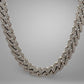Silver chain necklace on a gray background