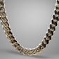Silver chain necklace on a gray background