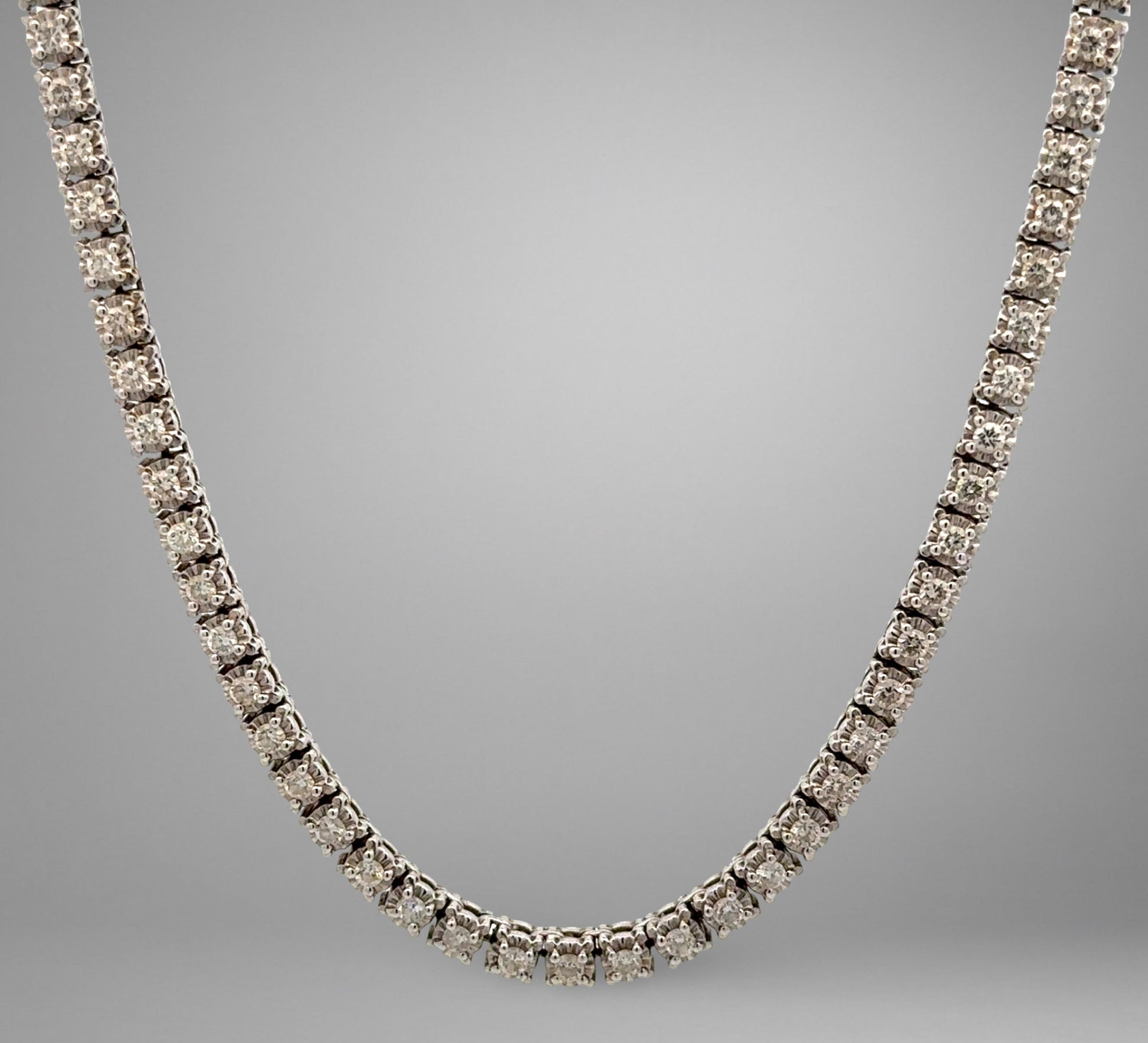 Diamond necklace on a gray background