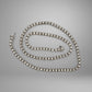 Diamond tennis necklace on a gray background