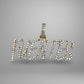 Diamond-studded pendant with the word 'FUENTES on a gray background