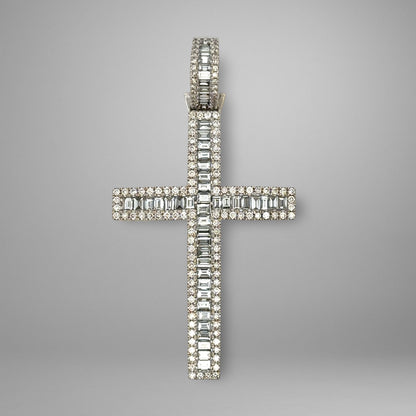 Diamond cross pendant on a gray background