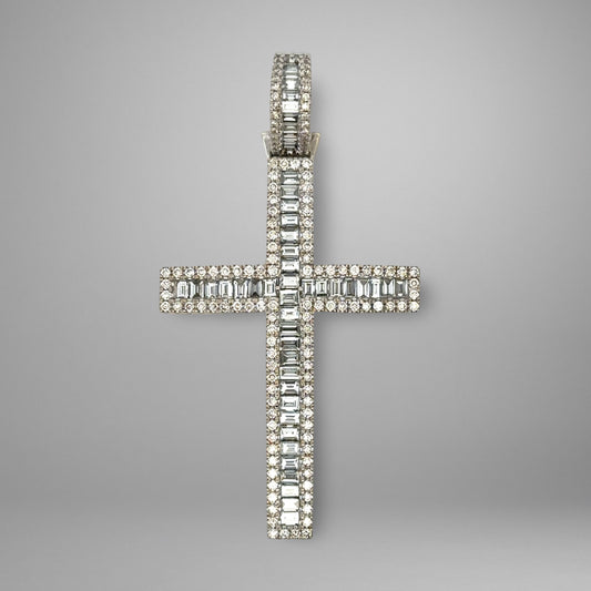 Diamond cross pendant on a gray background