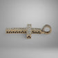 Silver cross pendant with intricate design on a gray background