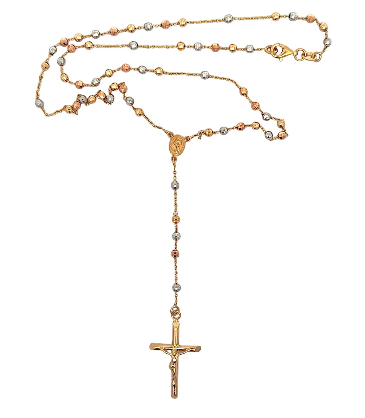 A gold-tone rosary necklace with alternating gold, white gold, and rose gold beads, featuring a gold medallion and a crucifix pendant, displayed on a clean white background.