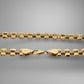 Gold chain with clasp on a gray background