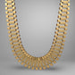 Gold necklace on a gray background