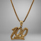 Gold necklace with a '100' pendant on a gray background