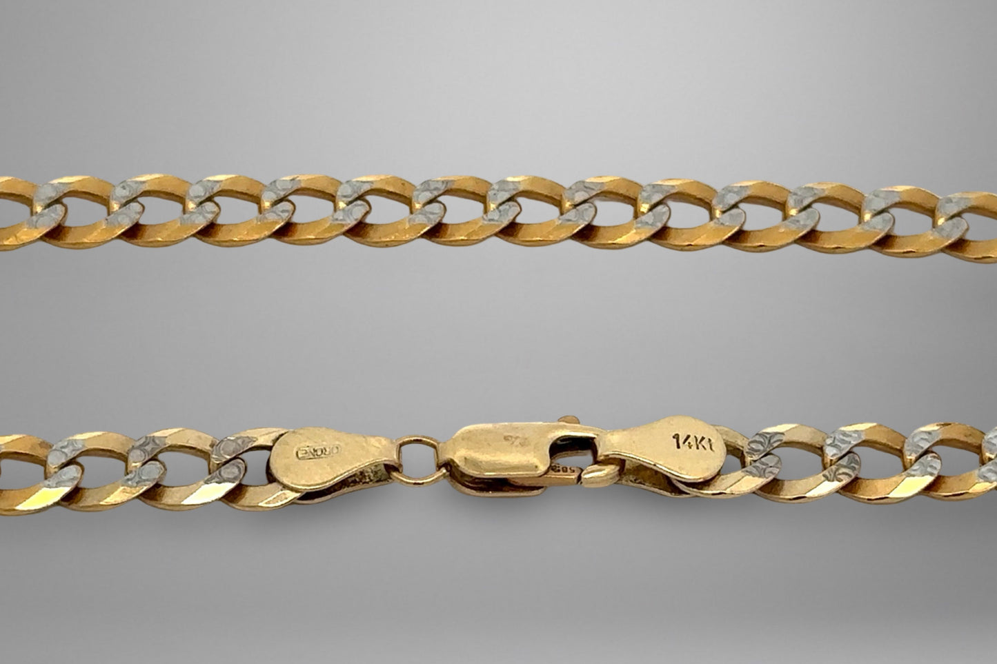 Gold chain on a gray background