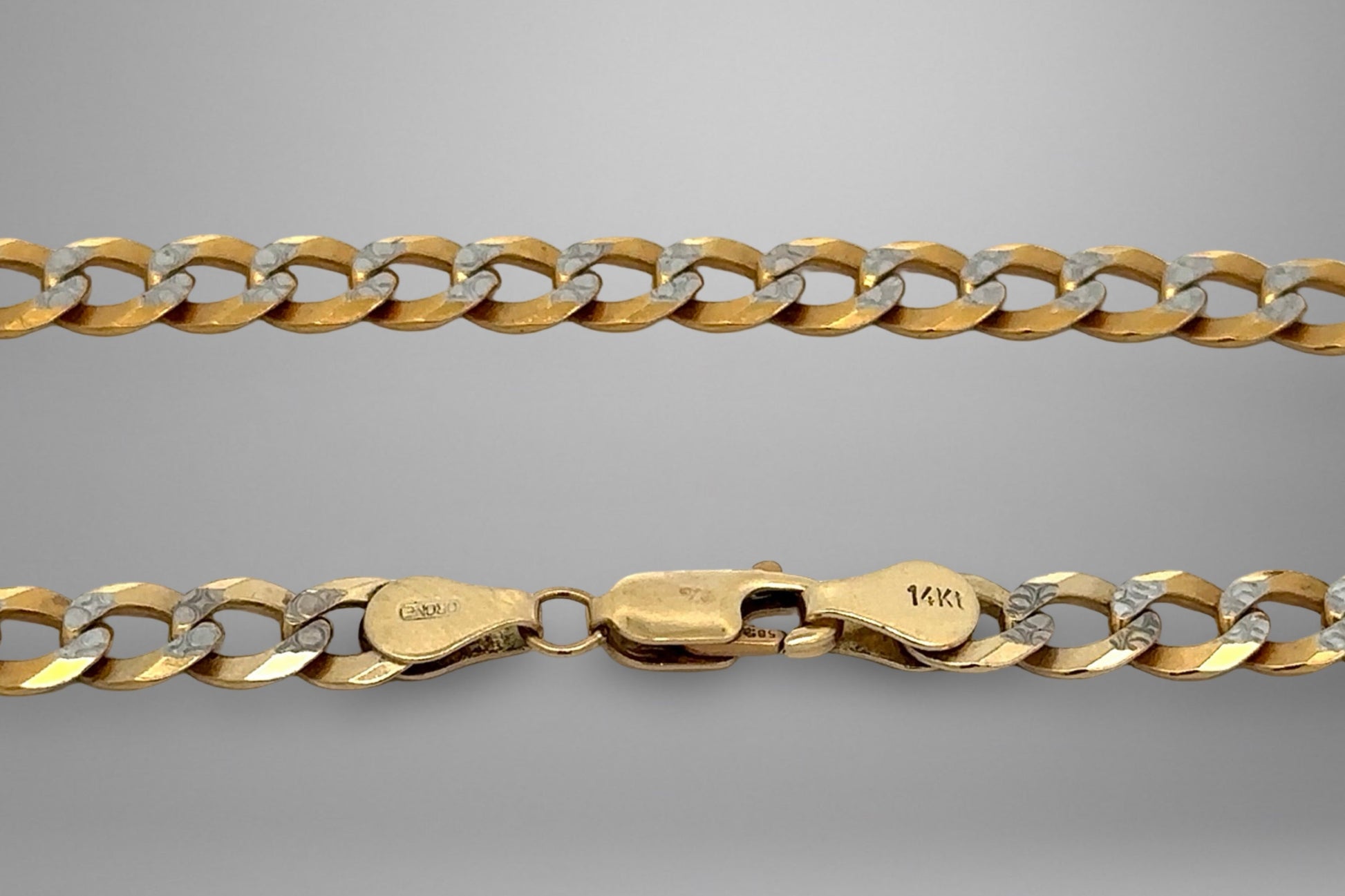 Gold chain on a gray background