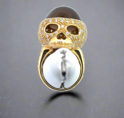 The skull ring on a ring stand to show what it would look like on the finger.