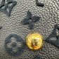 Scratches on gold button on bottom of bag