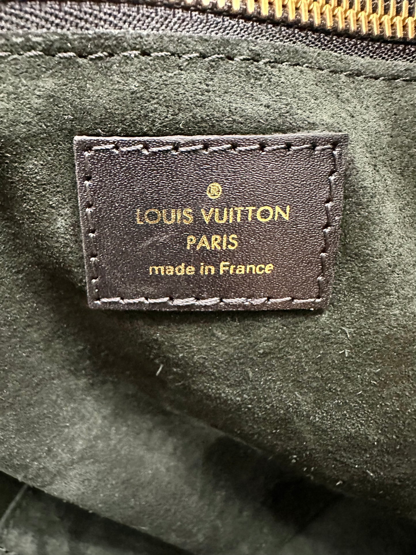 Louis Vuitton logo tag inside