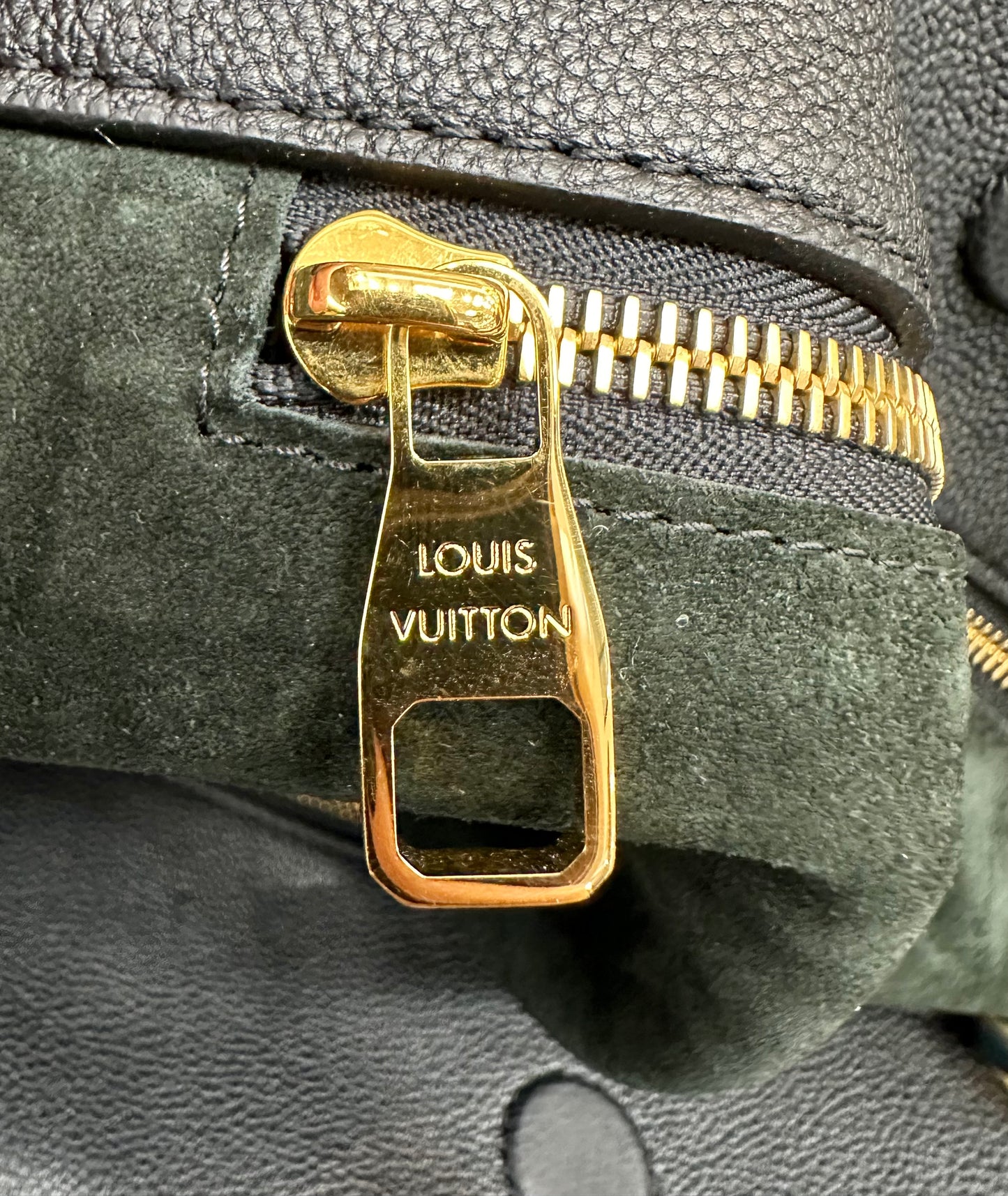 Gold zipper with light scratches