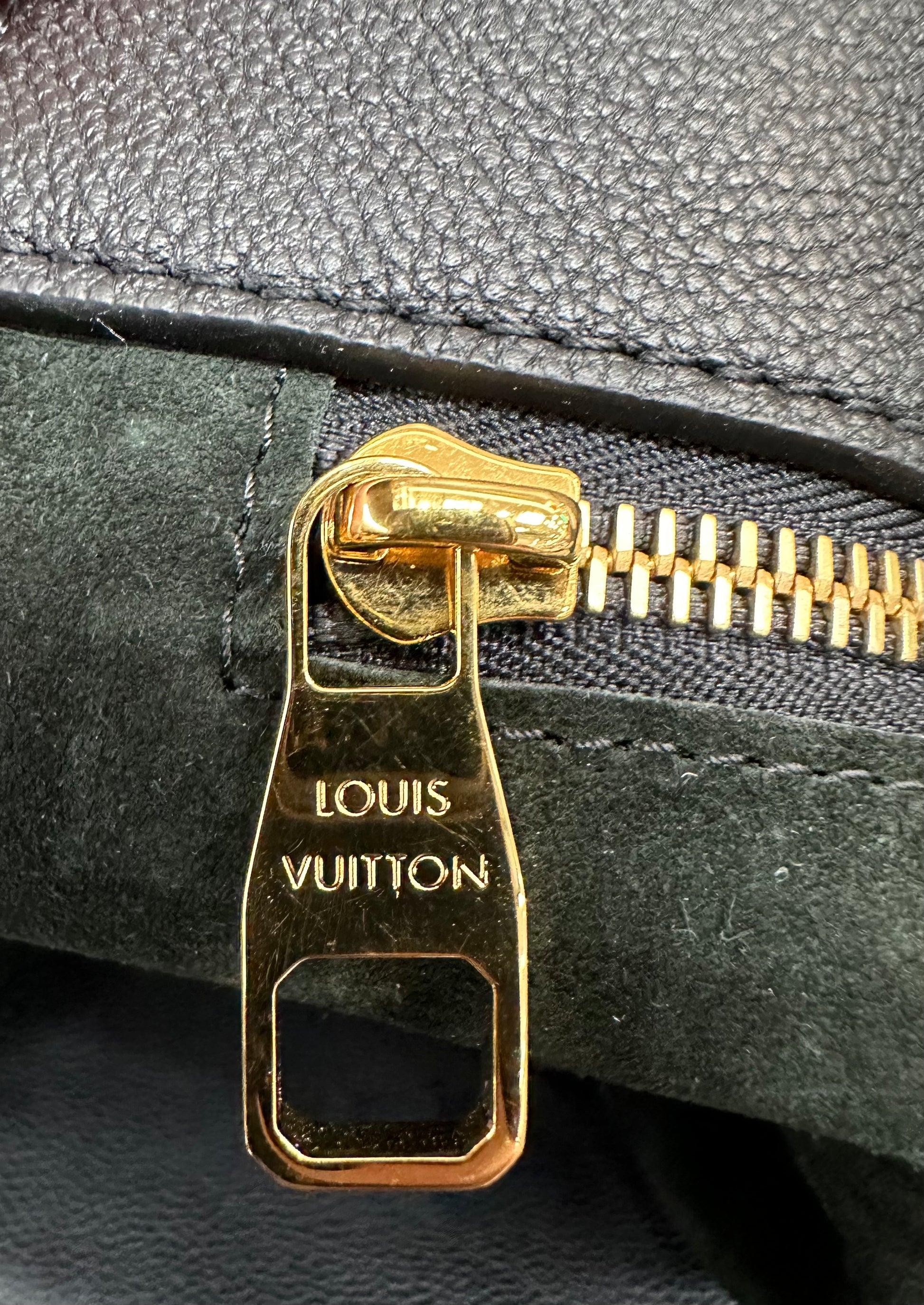 Gold zipper with light scratches