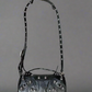 Purse with long shoulder strap stretched out