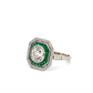 Diagonal view of diamond and emerald ring