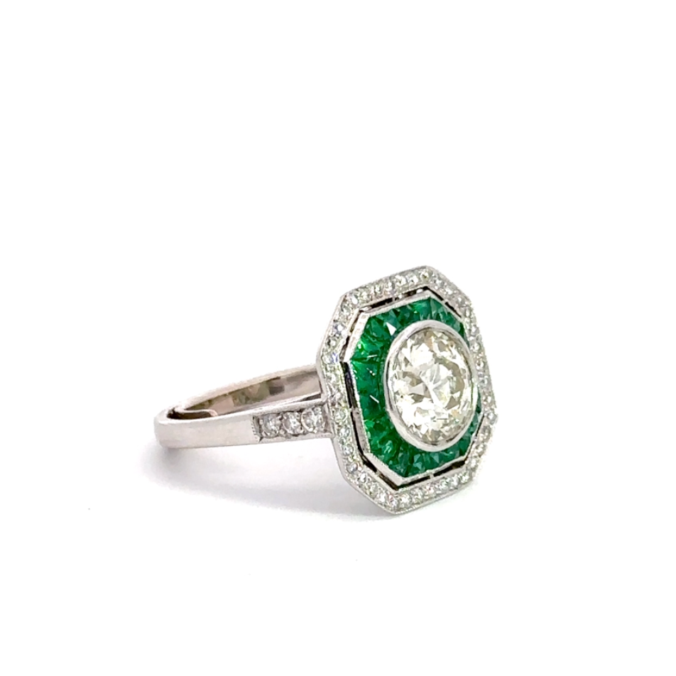 diagonal view of emerald and diamond ring