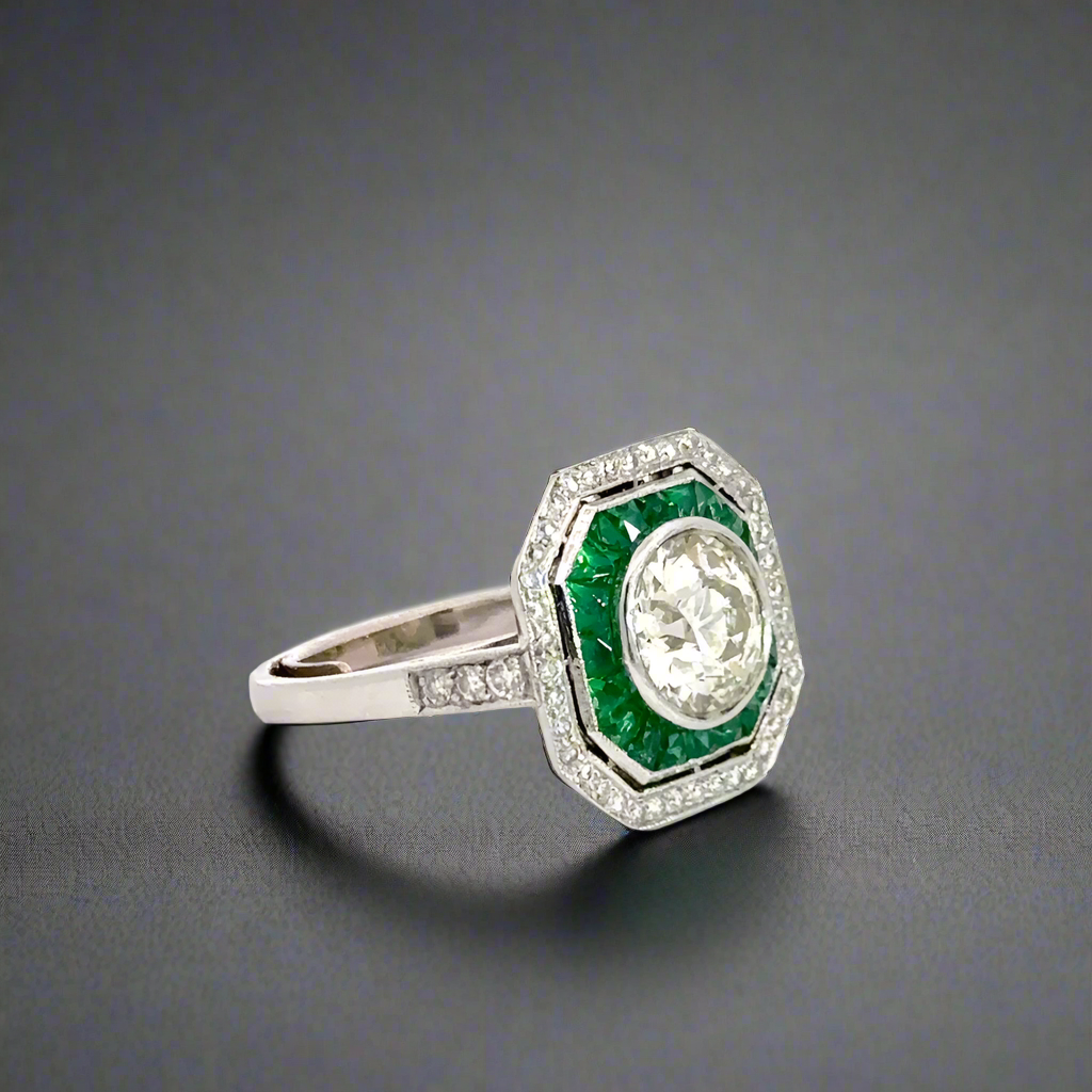 diagonal view of emerald and diamond ring