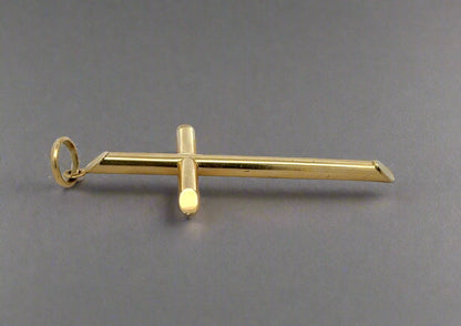 Side of cross pendant with scratches