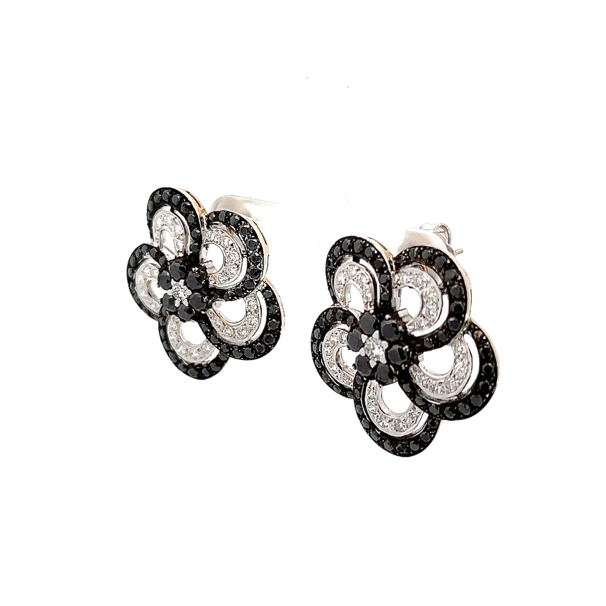diagonal view of black + white diamond flower earrings