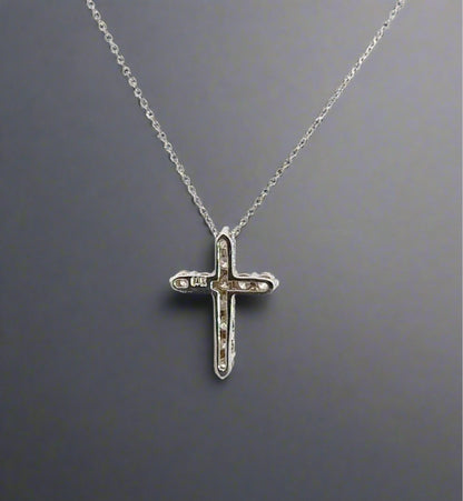 back of white gold cross with a 14K stamp