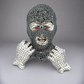 Ski mask face diamond pendant resembling a mask with gemstone details on a gray background