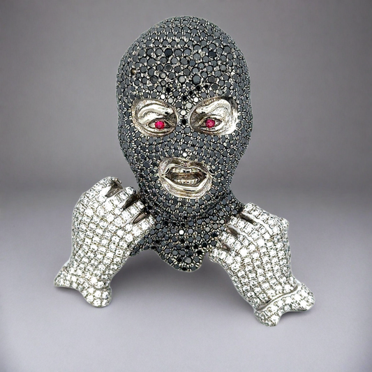 Ski mask face diamond pendant resembling a mask with gemstone details on a gray background
