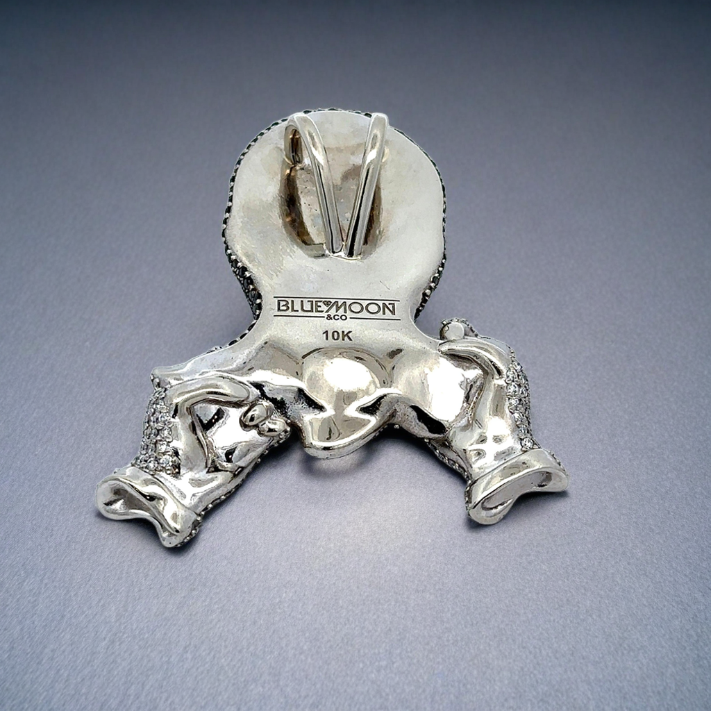 White gold pendant with 'Blue Moon' branding on a gray background