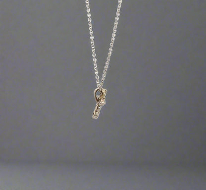 side of diamond cross necklace with attached bail