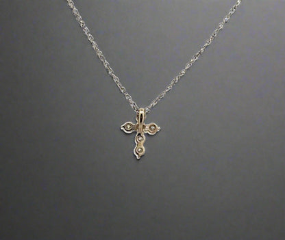 back of white gold cross necklace