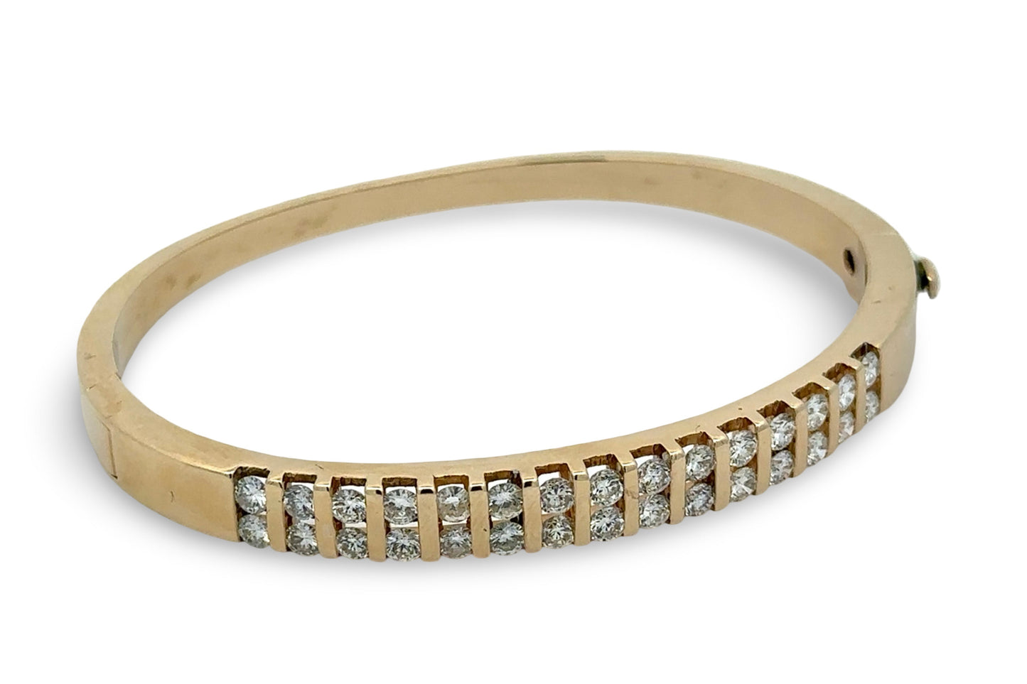 Gold bracelet with diamonds on a white background