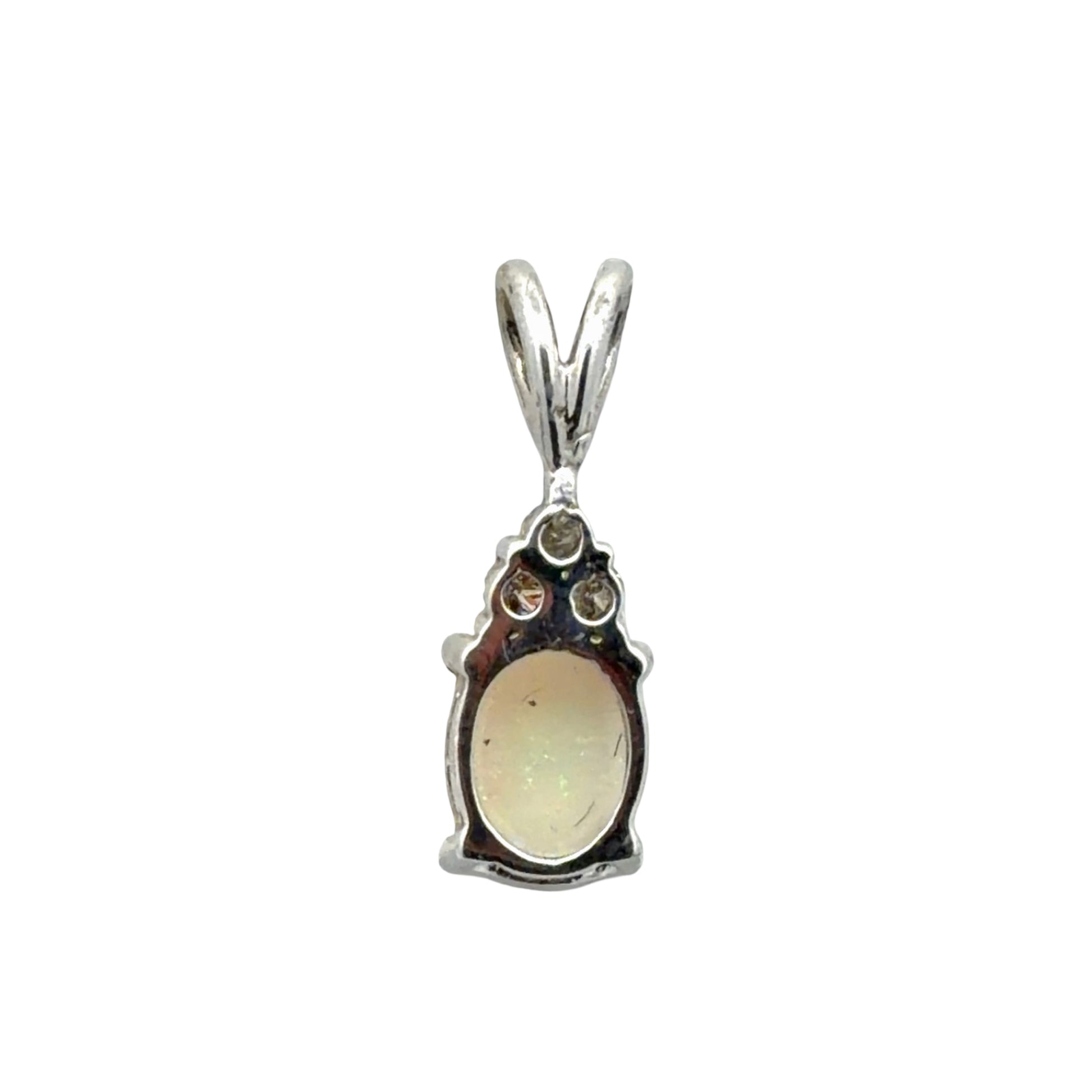 Back of white gold opal pendant on a white background