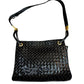 Black patent leather woven texture bag with gold hardware and misshaped shoulder strap