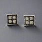 Front of black and white diamond square earrings