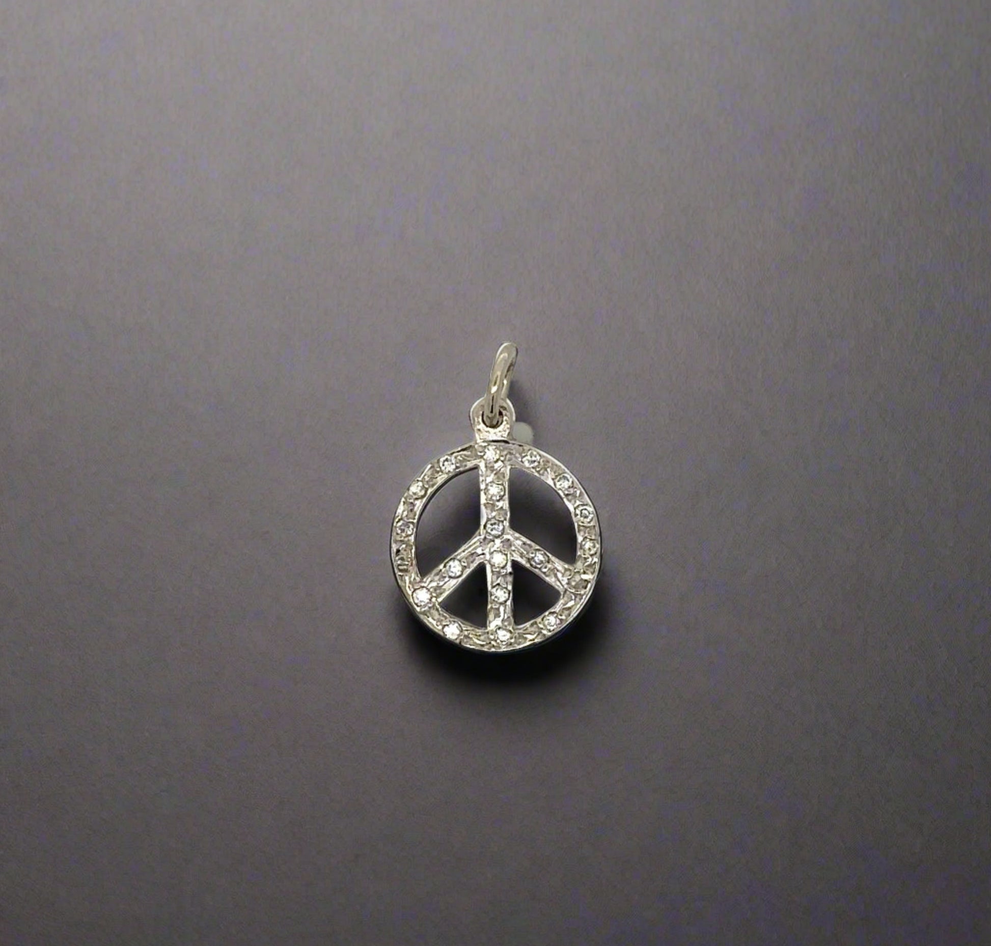 Front of diamond peace sign pendant