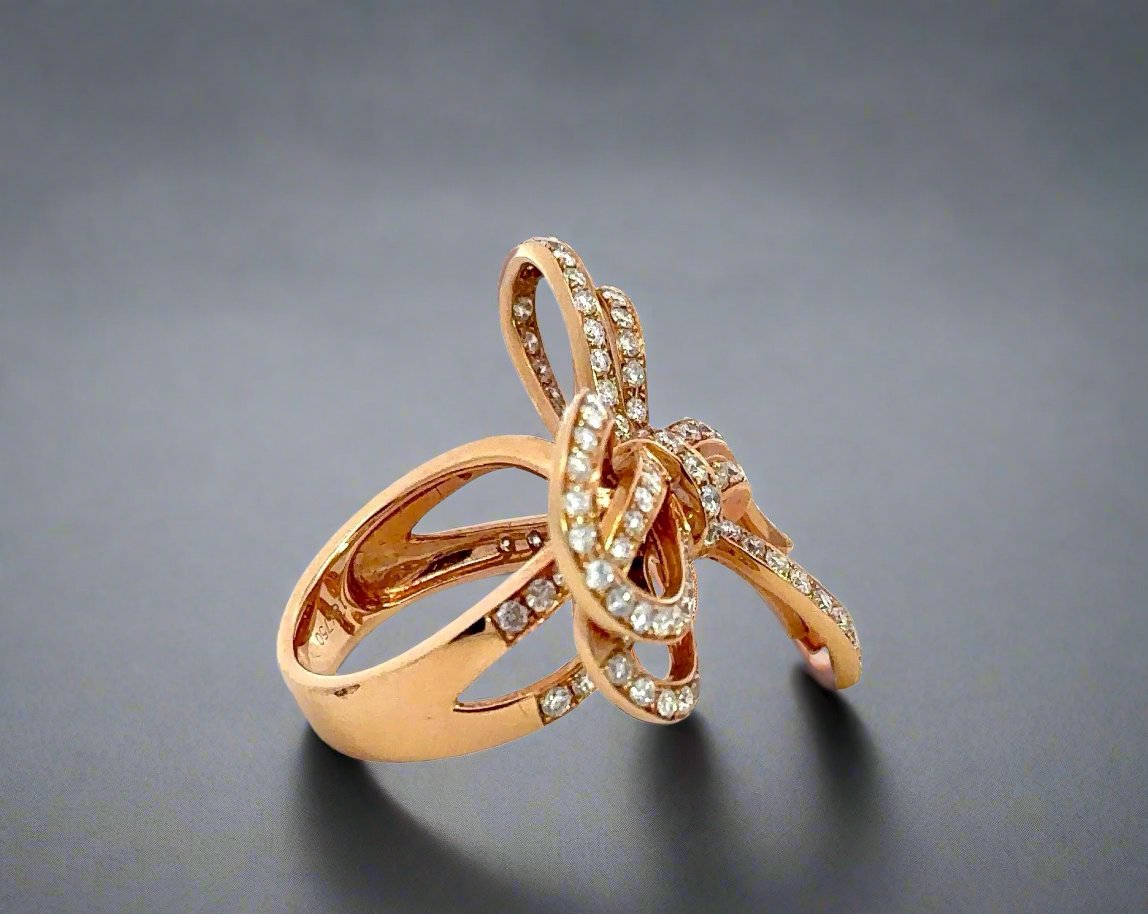 Side of rose gold diamond bow ring