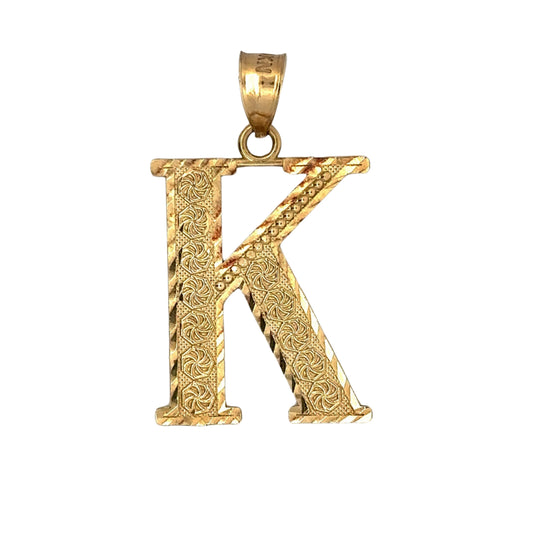 front of K pendant with designs on gold